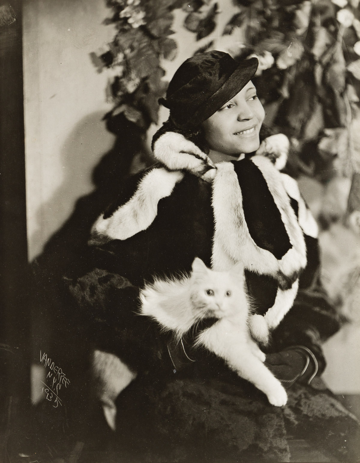 JAMES VANDERZEE (1886 - 1983) Untitled (Woman in Fur Holding Cat).